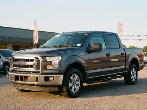 A grey 2014 crew-cab pickup on the lot. Sample photo.