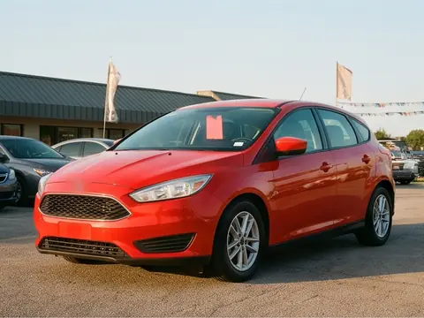 A red 2016 compact hatchback on the lot. Sample photo.